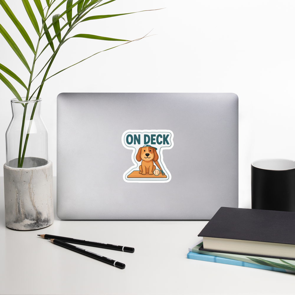 ON DECK 4 inch baseball sticker on a laptop in a front-facing indoor desk scene with books, a mug and a plant. Styling props are not included.