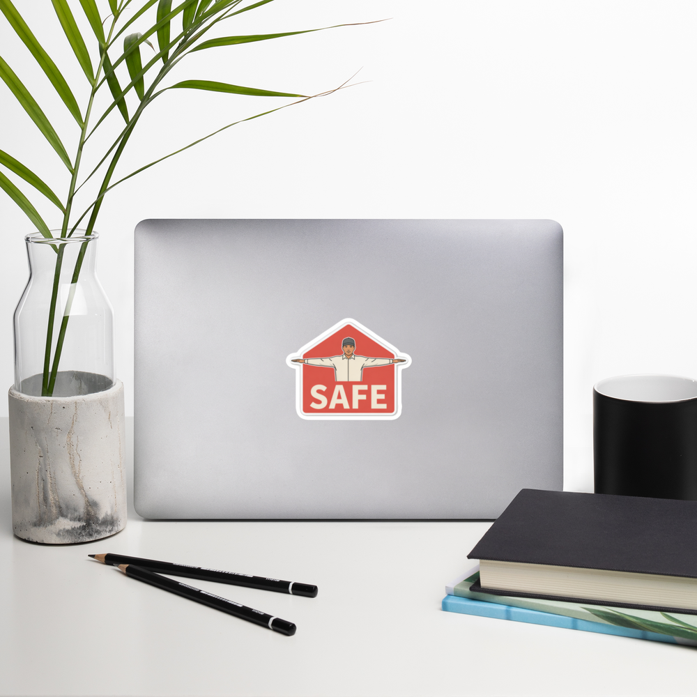 SAFE 4 inch baseball sticker on a laptop in a front-facing indoor desk scene with books, a mug and a plant. Styling props are not included.