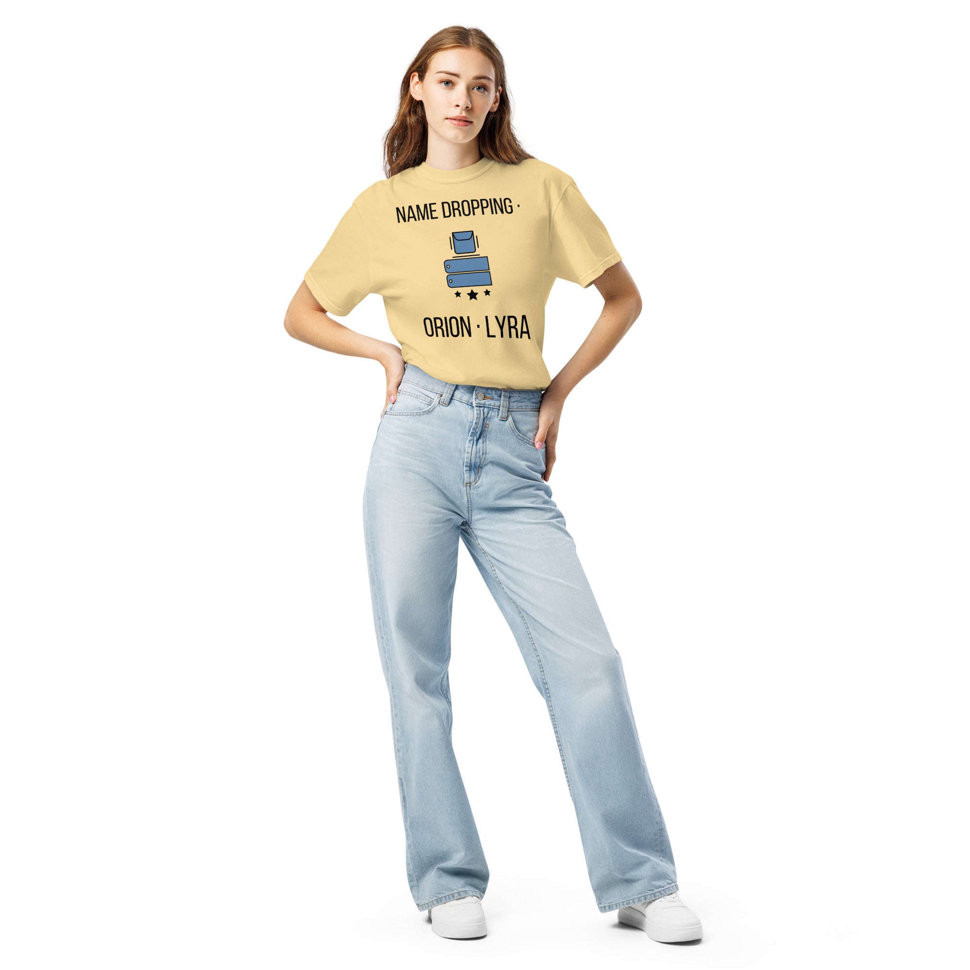 Full-length front view of a woman in the Butter Name Dropping orion constellation shirt with light jeans