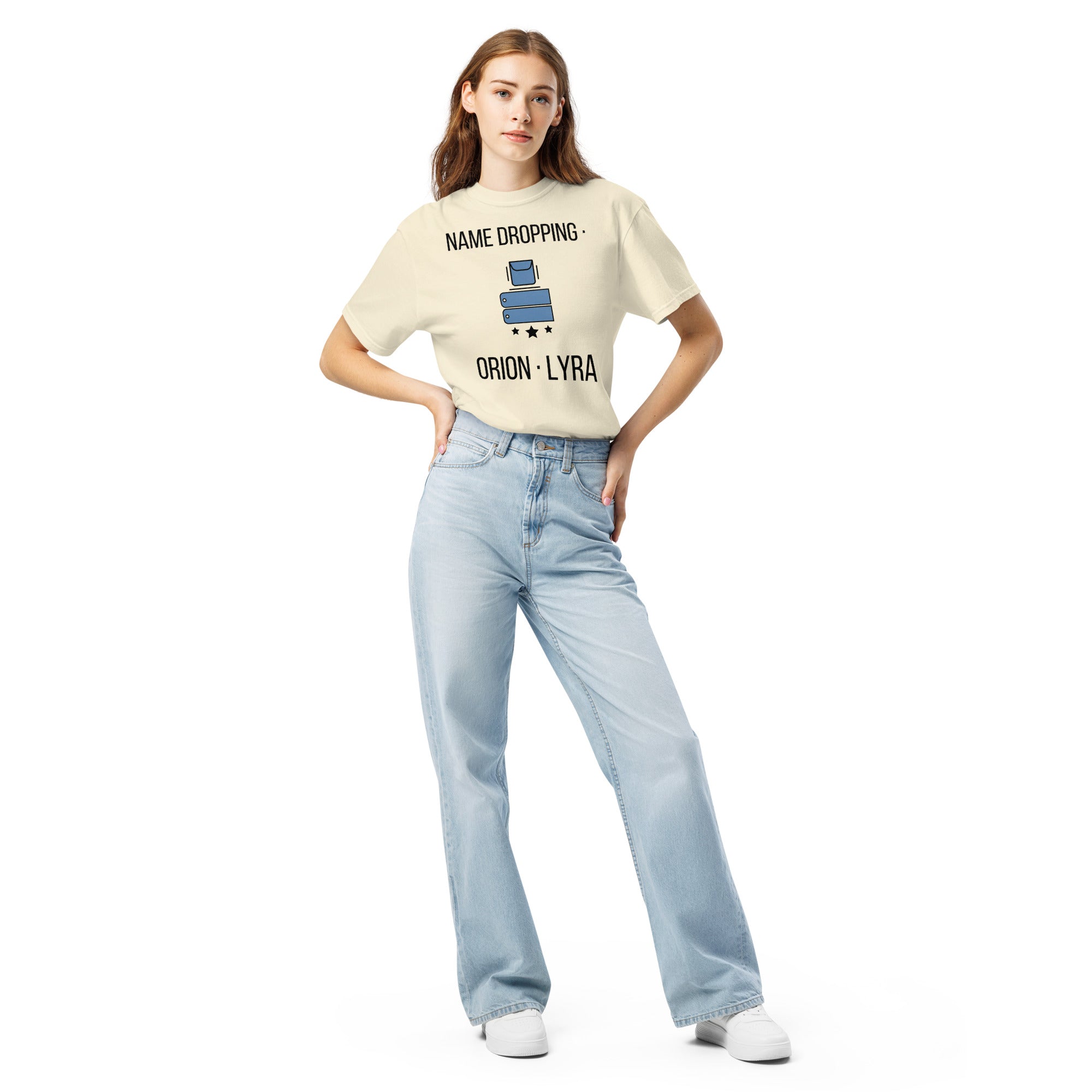 Full-length front view of a woman in the Ivory Name Dropping orion constellation shirt with light jeans