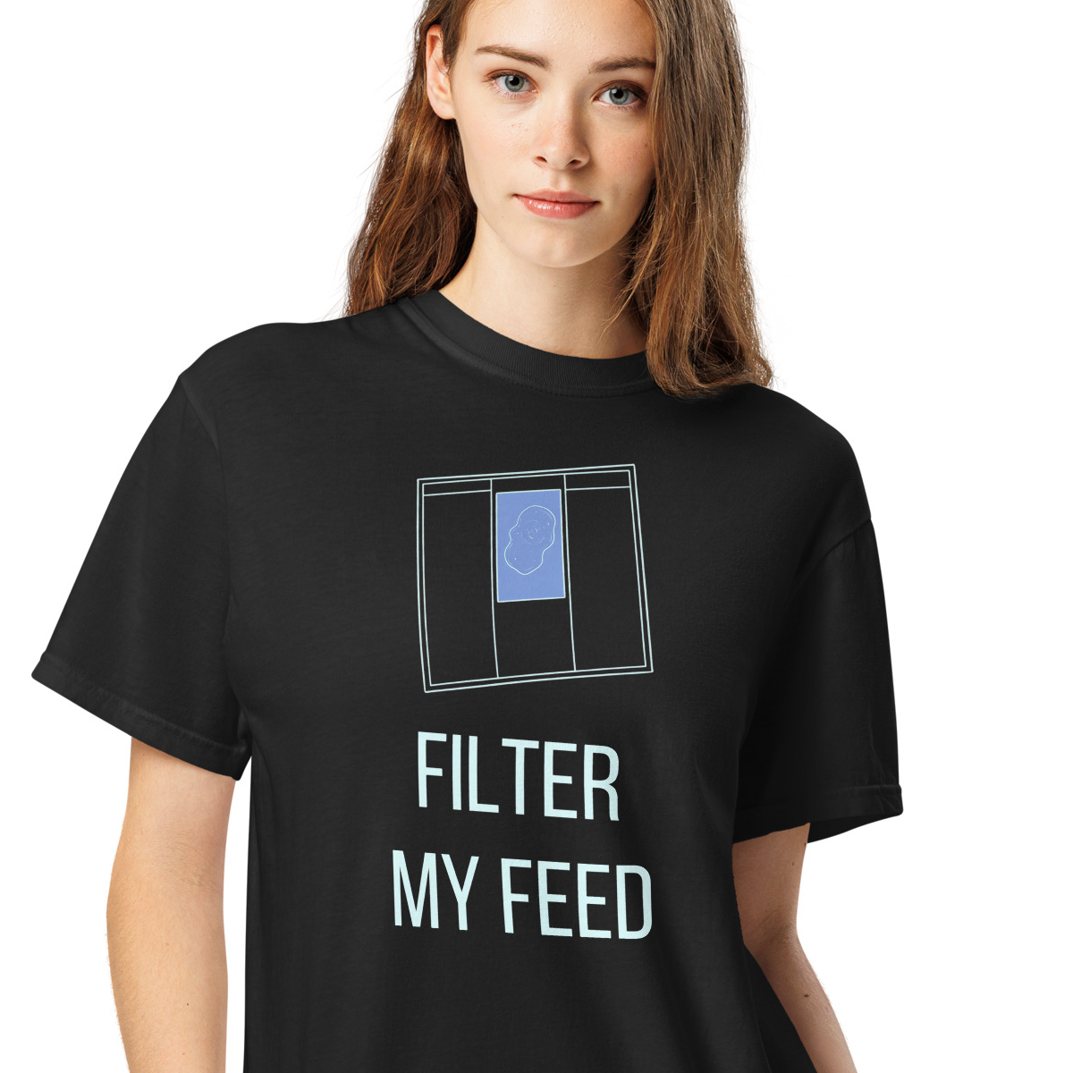 Woman wearing a black nebula shirt printed with a tilted filter frame holding one periwinkle nebula sketch card above the words FILTER MY FEED
