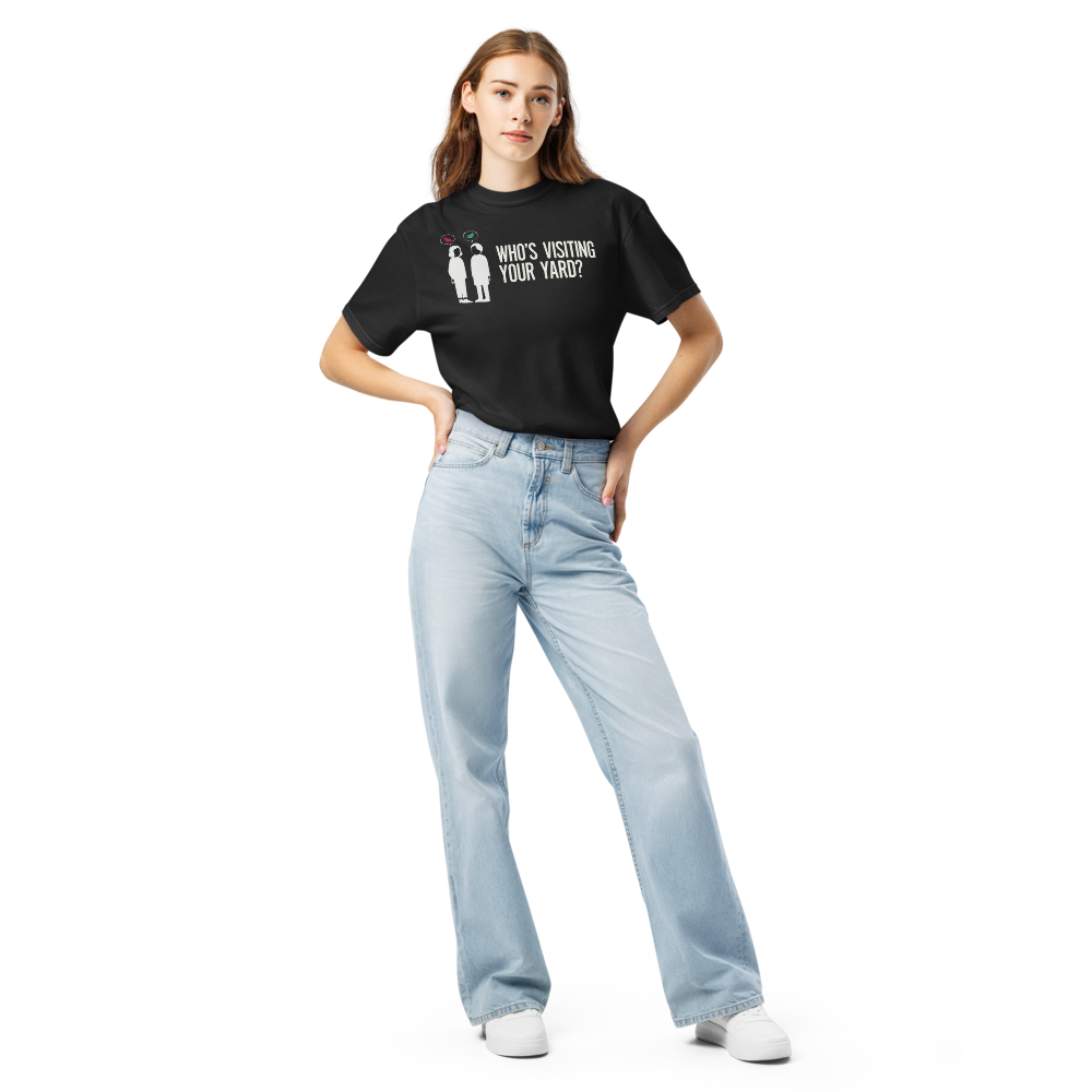 Woman wearing the black backyard bird shirt with two neighbors with bird speech bubbles and WHO'S VISITING YOUR YARD?