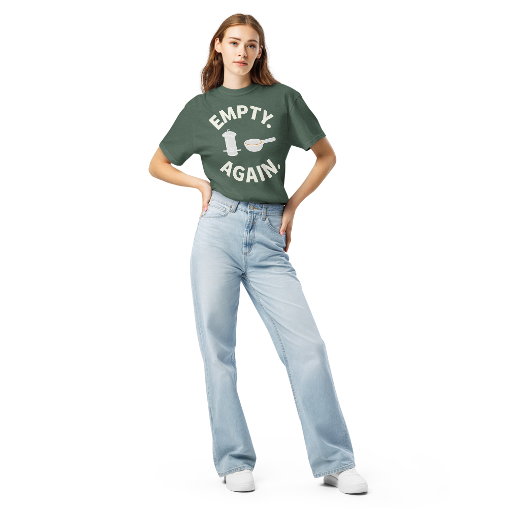 Woman wearing the Blue Spruce bird shirt for women with EMPTY. AGAIN. curved around a feeder and scoop