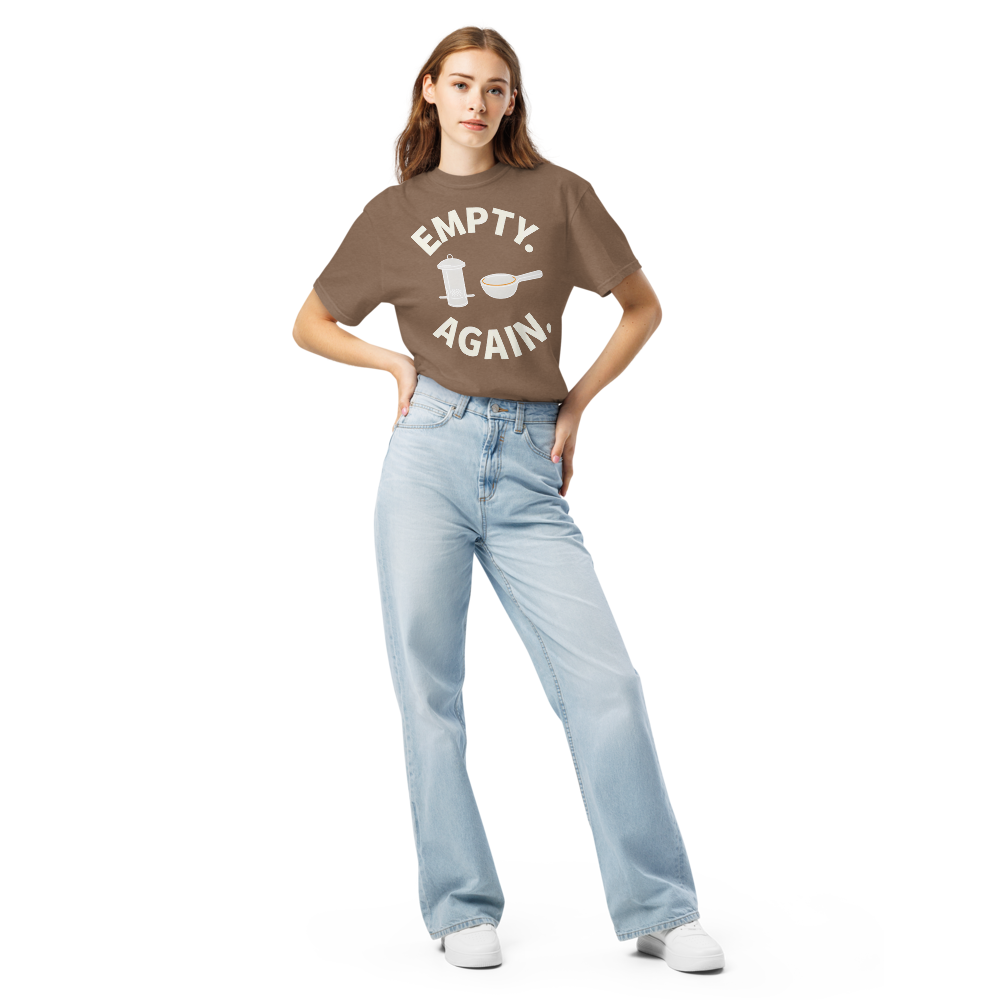 Woman wearing the Espresso bird shirt for women with EMPTY. AGAIN. curved around a feeder and scoop