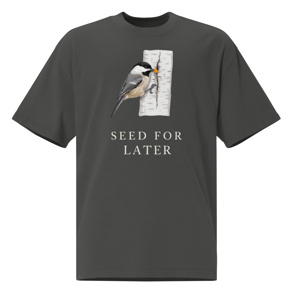 Bird T Shirt in Faded Coal, front view: a chickadee tucking a seed into birch bark above SEED FOR LATER
