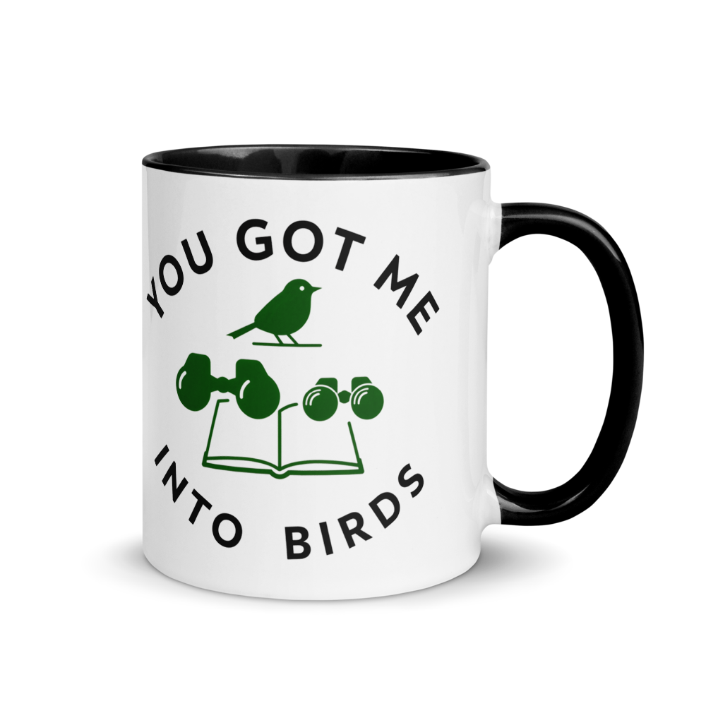 Bird watcher gift mug with black inside, 11 oz, handle on the right: YOU GOT ME INTO BIRDS around a bird, binoculars and a field guide