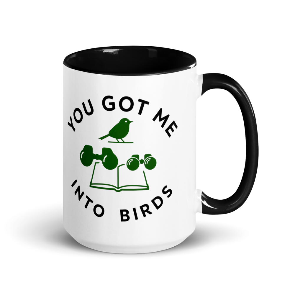 Bird watcher gift mug with black inside, 15 oz, handle on the right: YOU GOT ME INTO BIRDS around a bird, binoculars and a field guide