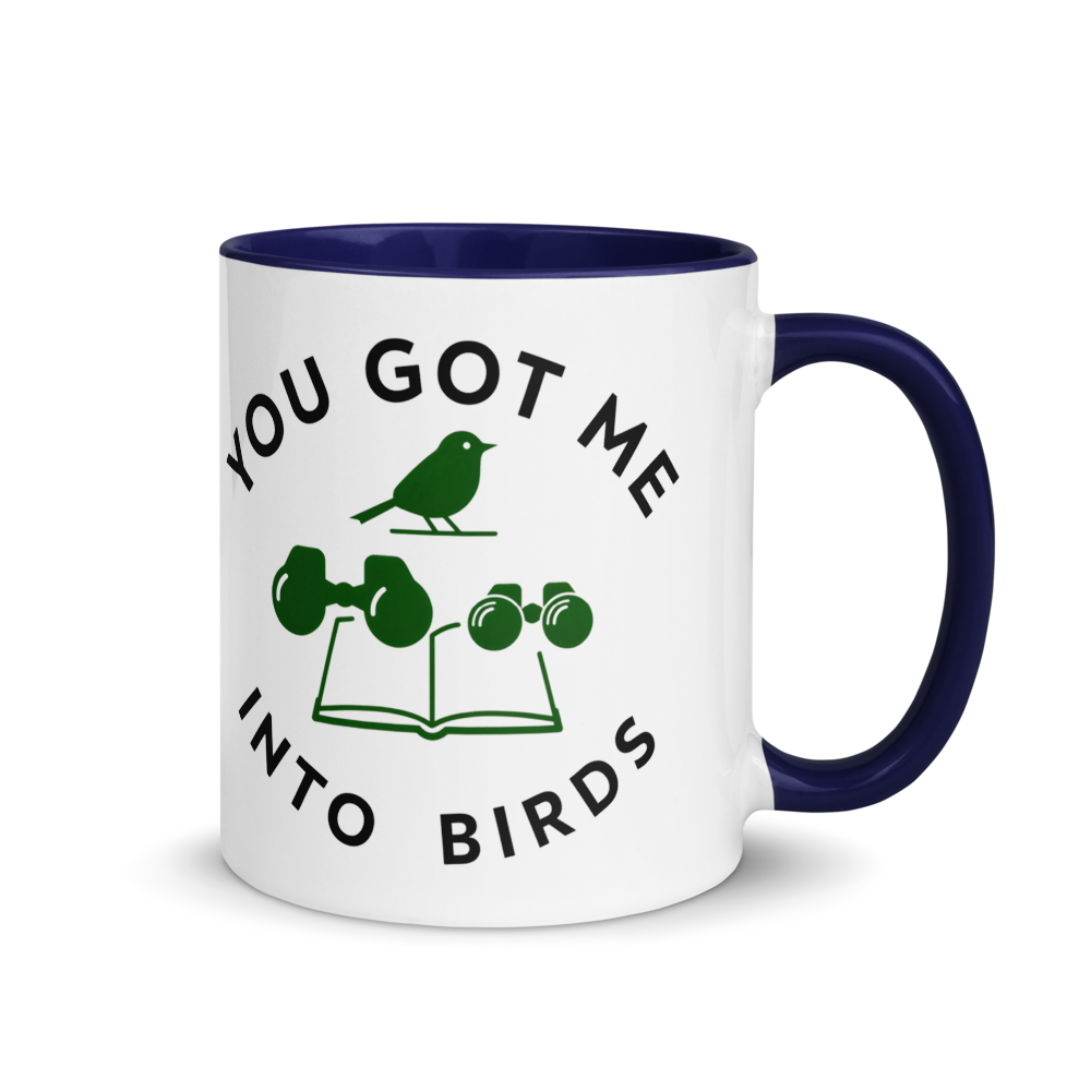 Bird watcher gift mug with dark blue inside, 11 oz, handle on the right: YOU GOT ME INTO BIRDS around a bird, binoculars and a field guide