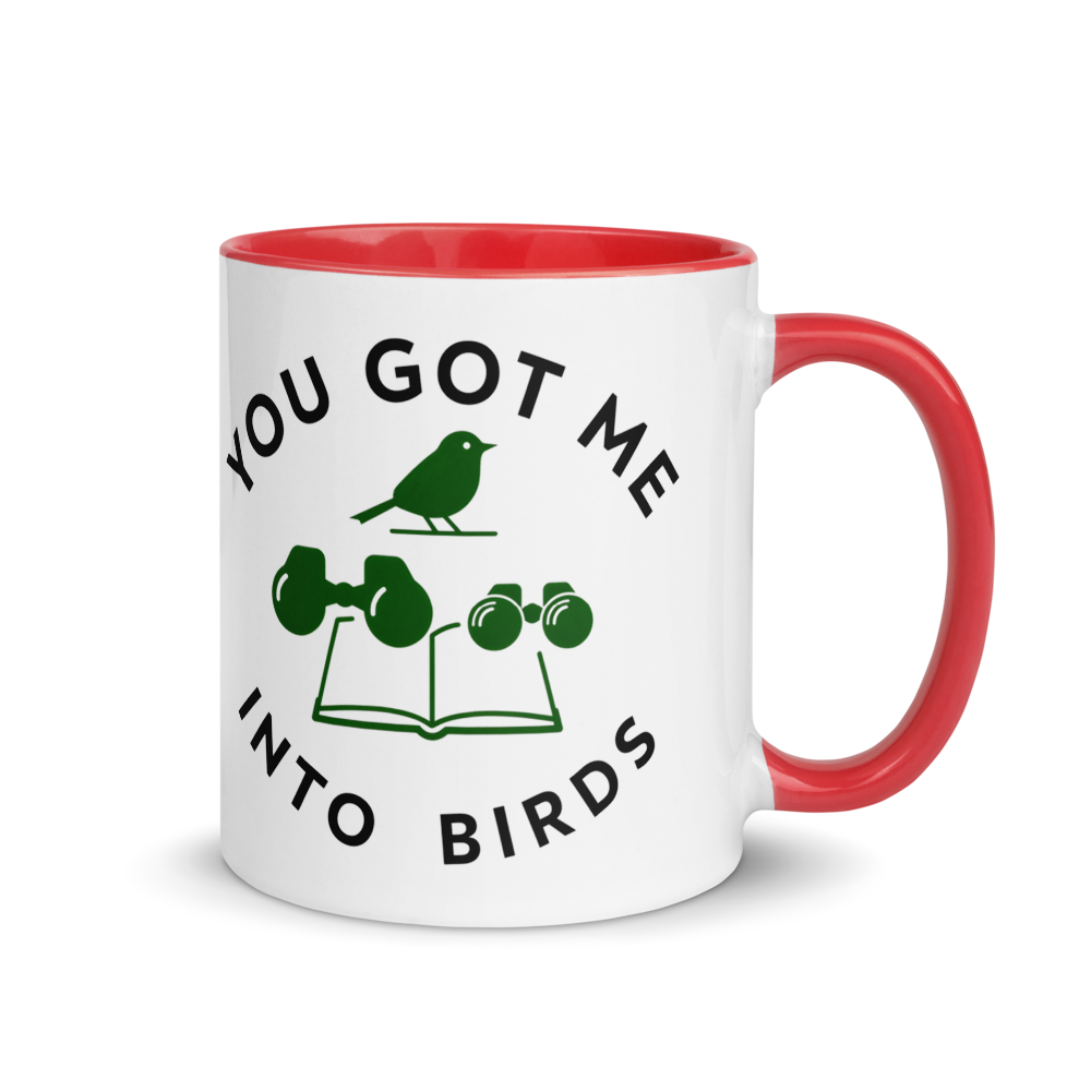 Bird watcher gift mug with red inside, 11 oz, handle on the right: YOU GOT ME INTO BIRDS around a bird, binoculars and a field guide