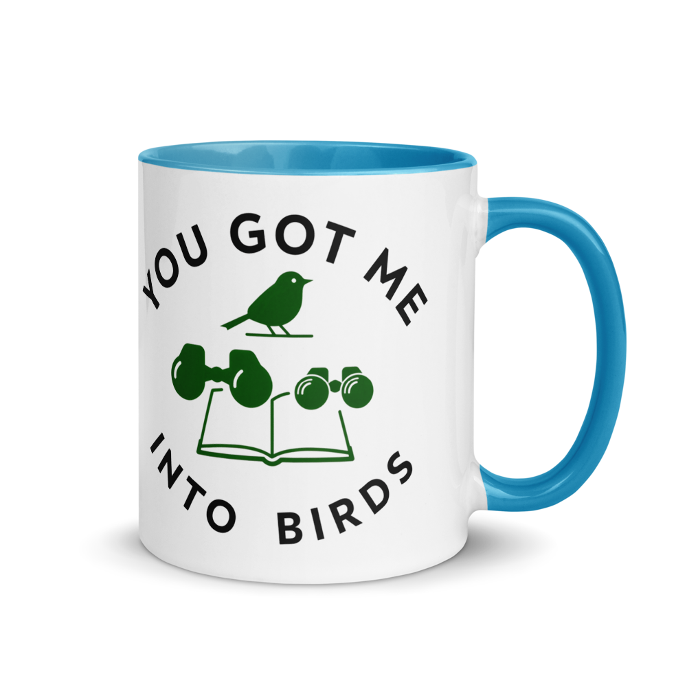 Bird watcher gift mug with blue inside, 11 oz, handle on the right: YOU GOT ME INTO BIRDS around a bird, binoculars and a field guide