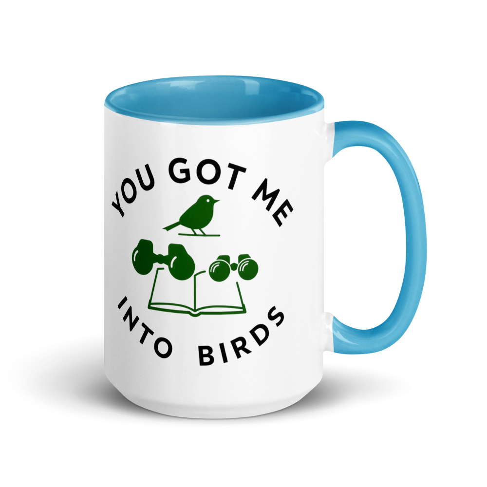 Bird watcher gift mug with blue inside, 15 oz, handle on the right: YOU GOT ME INTO BIRDS around a bird, binoculars and a field guide