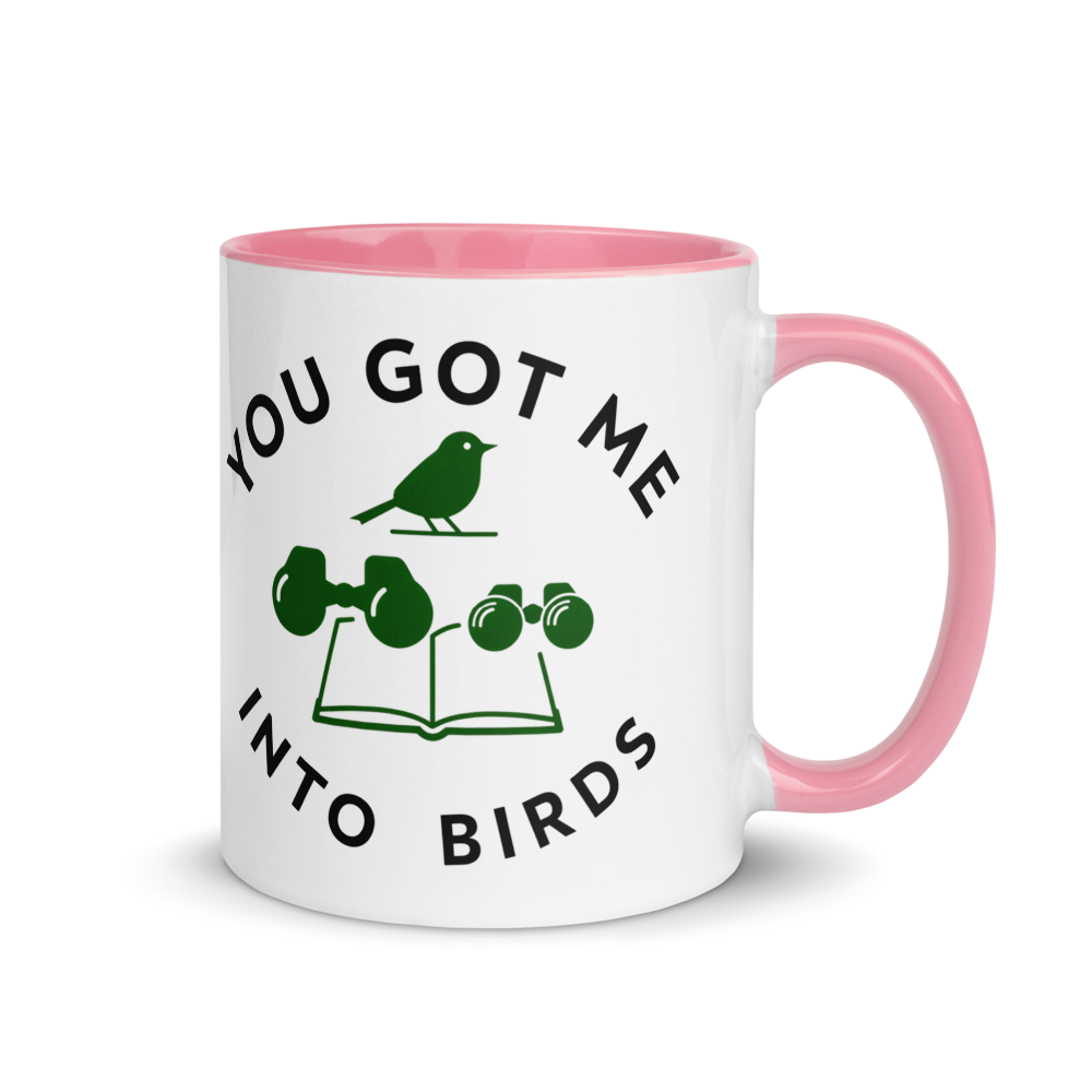 Bird watcher gift mug with pink inside, 11 oz, handle on the right: YOU GOT ME INTO BIRDS around a bird, binoculars and a field guide