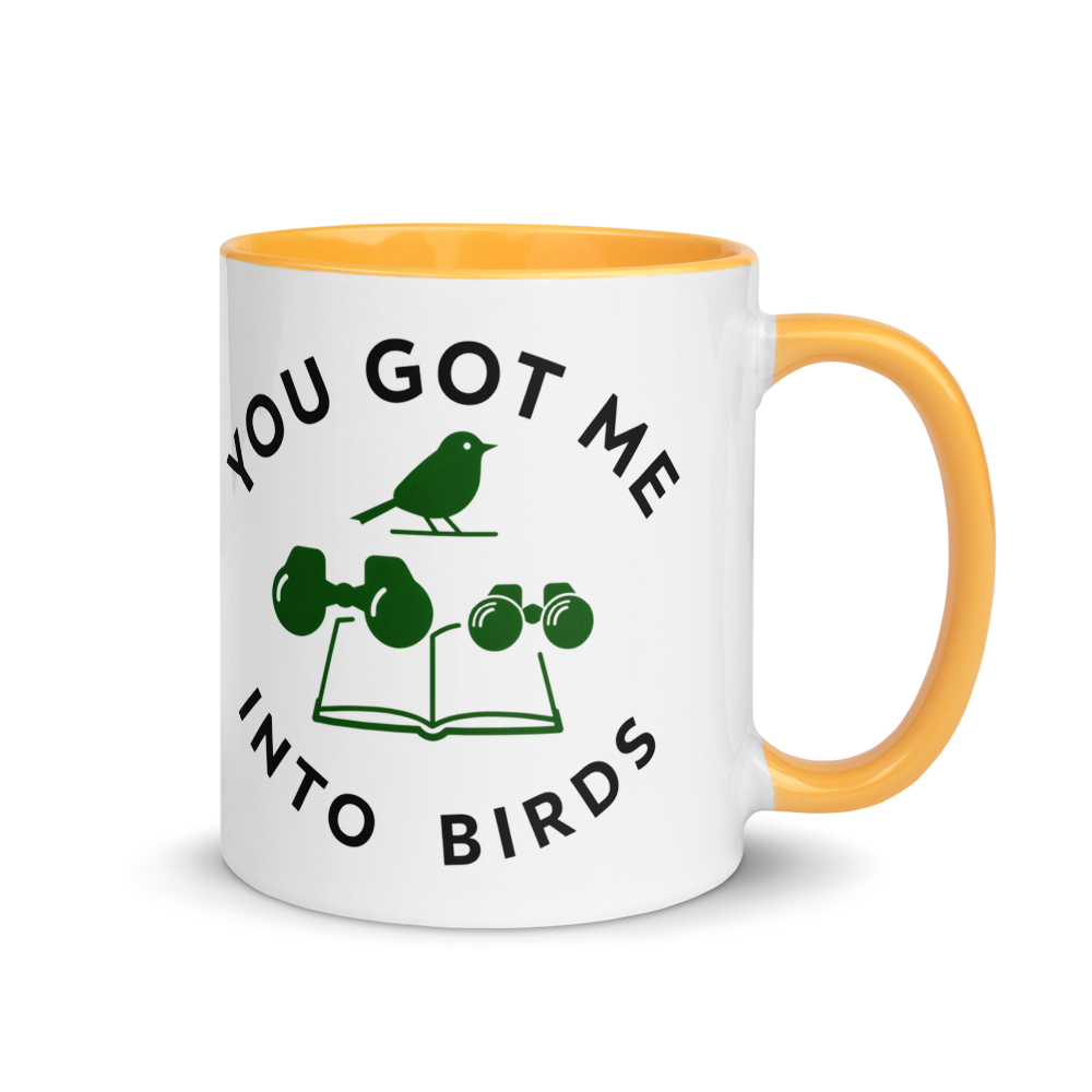 Bird watcher gift mug with golden yellow inside, 11 oz, handle on the right: YOU GOT ME INTO BIRDS around a bird, binoculars and a field guide