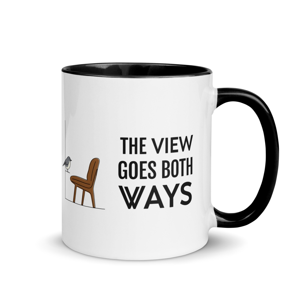 Bird watching mug with black inside, 11 oz, handle on the right: THE VIEW GOES BOTH WAYS beside a bird on the sill and an empty chair