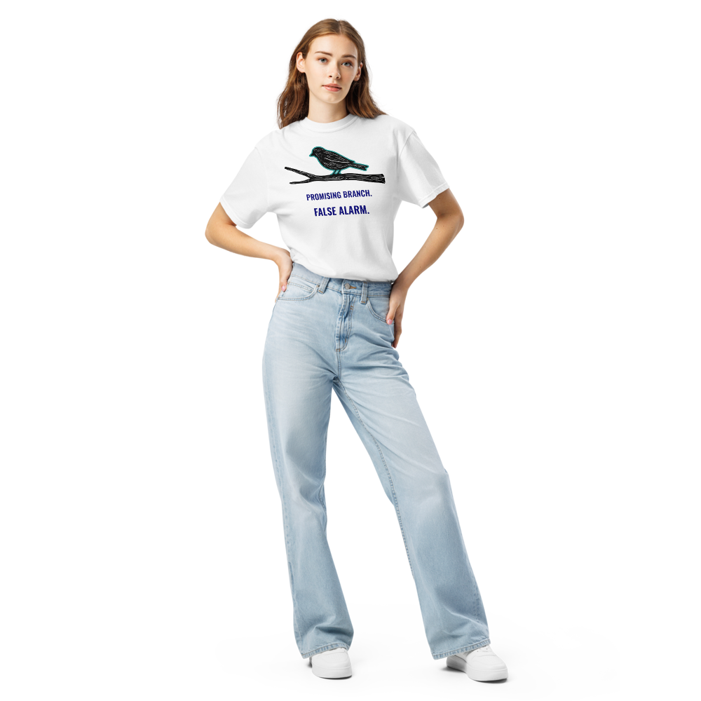 Woman wearing the white bird watching shirt with a bird-shaped branch above PROMISING BRANCH. FALSE ALARM.