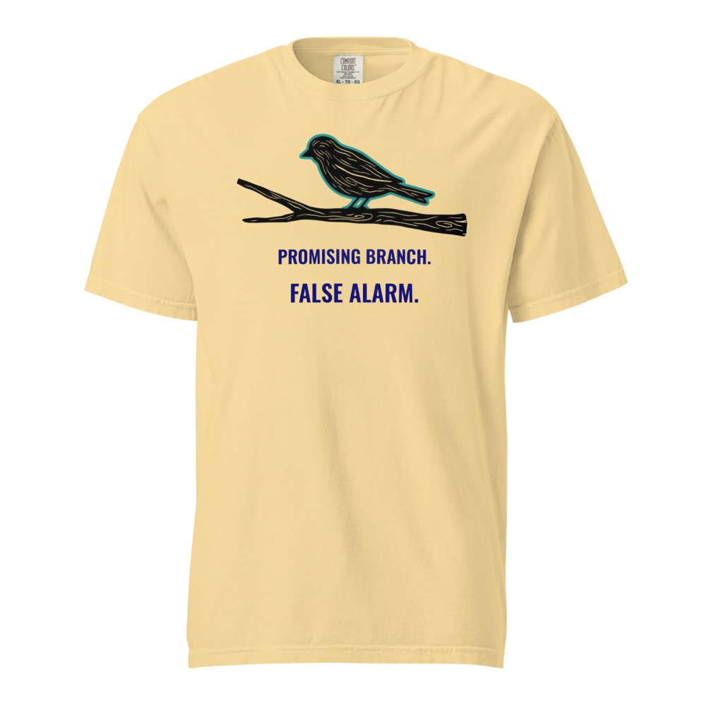 Bird Watching Shirt in Butter, front view: a bird-shaped branch above PROMISING BRANCH. FALSE ALARM.
