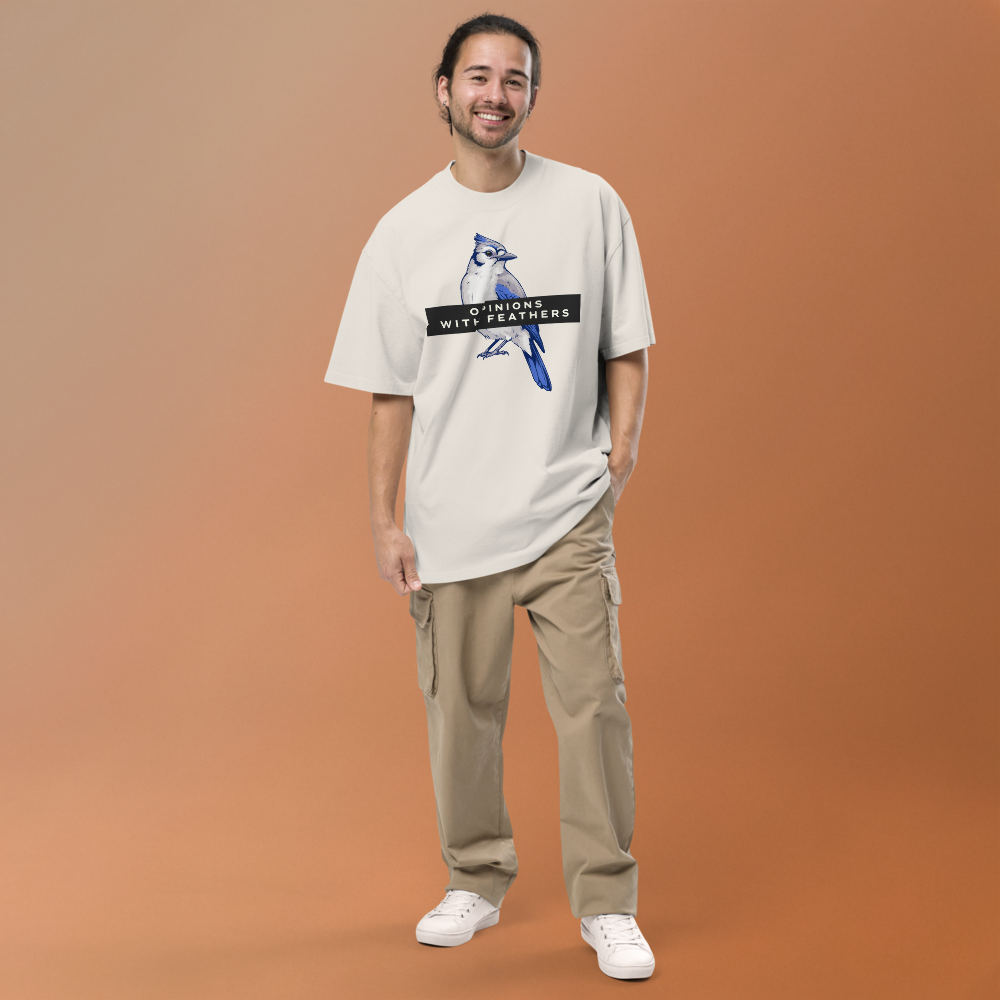 Man in the faded bone blue jay shirt against a warm backdrop