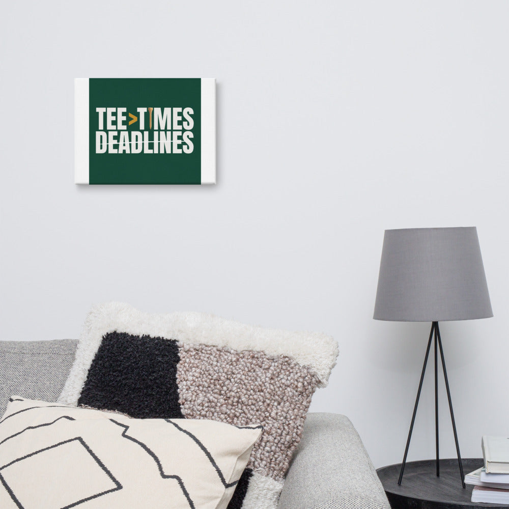 Tee Times Greater Than Deadlines canvas hung above a desk in a den, stacked display type in chalk white and gold