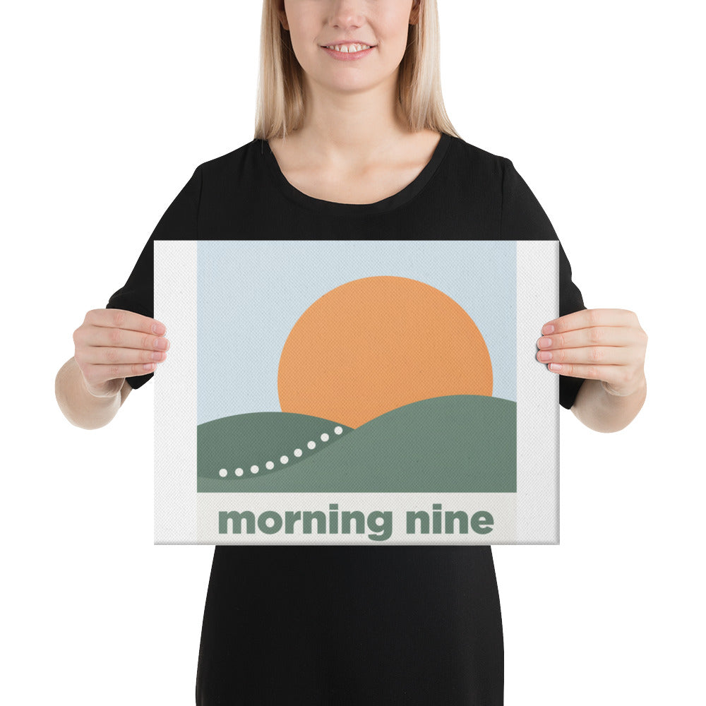 A person holding the Morning Nine golf canvas print to show the 12 by 16 inch size in scale