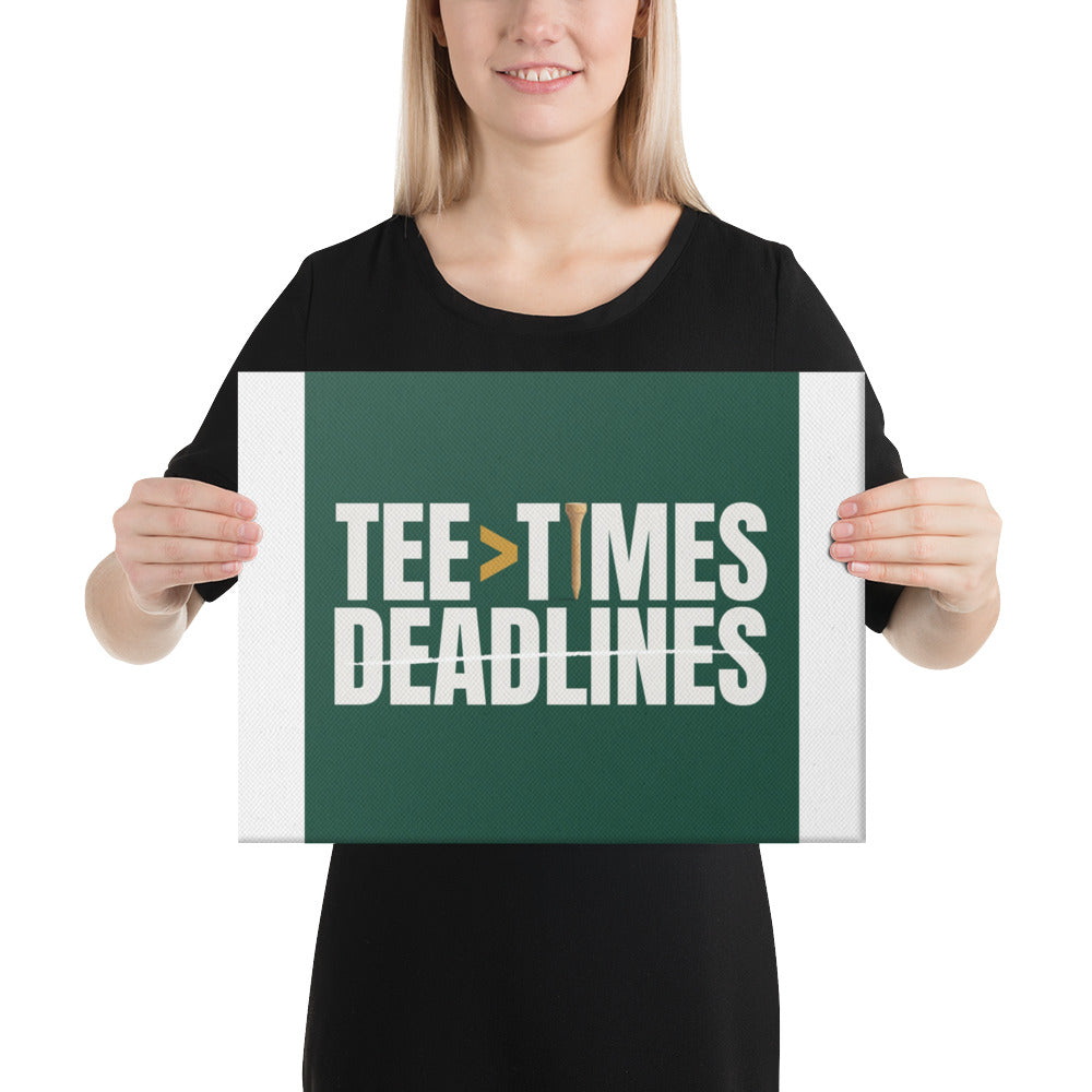 Person holding the Tee Times Greater Than Deadlines golf canvas to show the 12 by 16 inch scale and 1.25 inch deep stretched edge