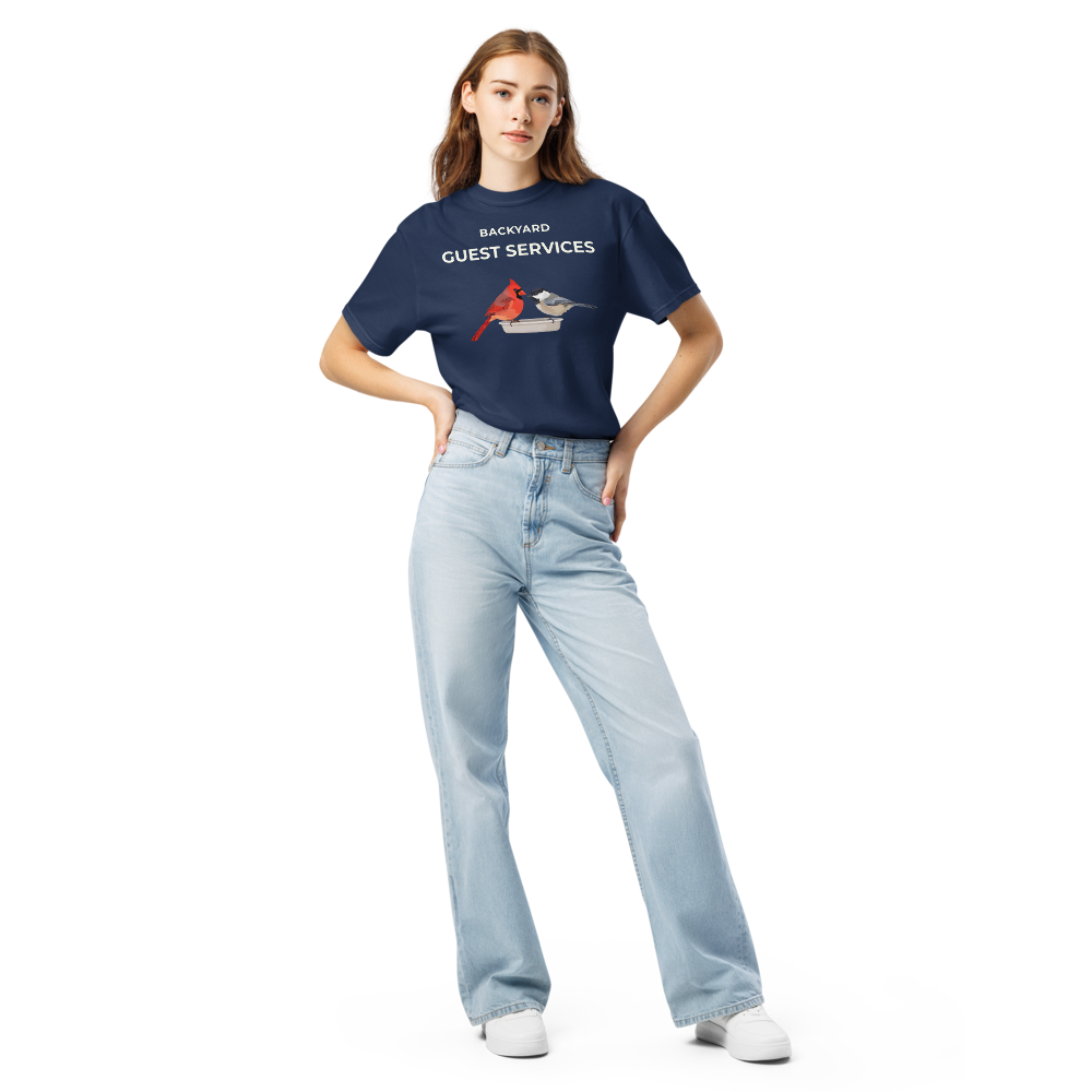 Woman wearing the True Navy cardinal shirt with BACKYARD GUEST SERVICES above a cardinal and a chickadee at a tray feeder