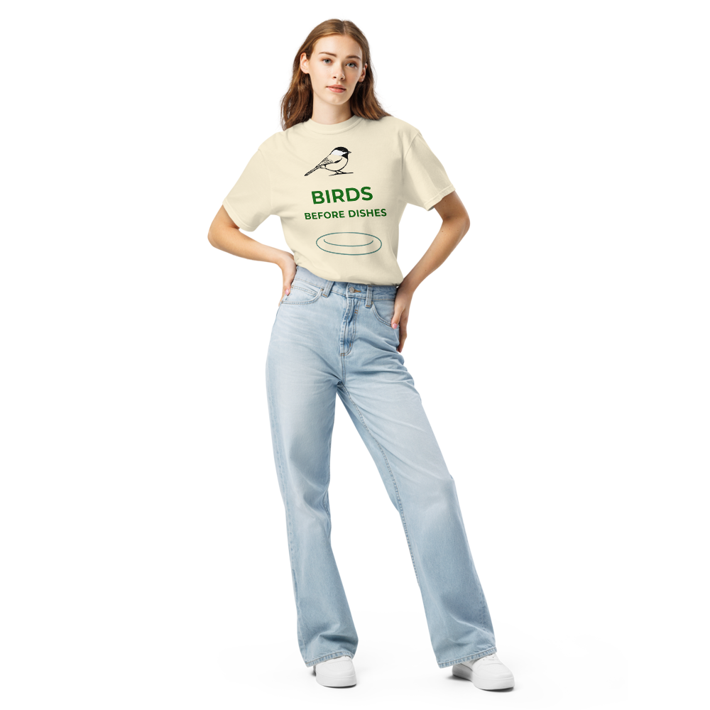 Woman wearing the Ivory chickadee shirt with a chickadee above BIRDS BEFORE DISHES and a plate outline