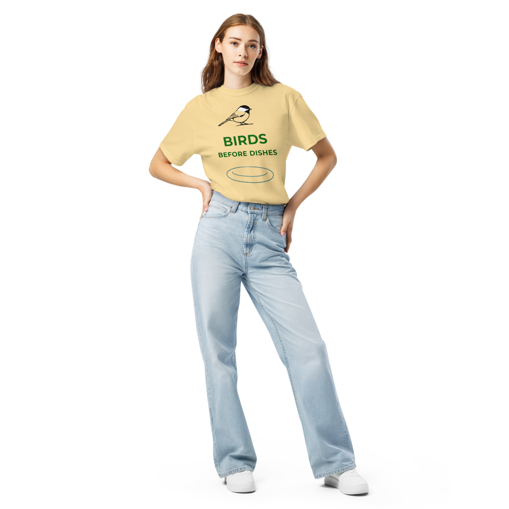 Woman wearing the Butter chickadee shirt with a chickadee above BIRDS BEFORE DISHES and a plate outline