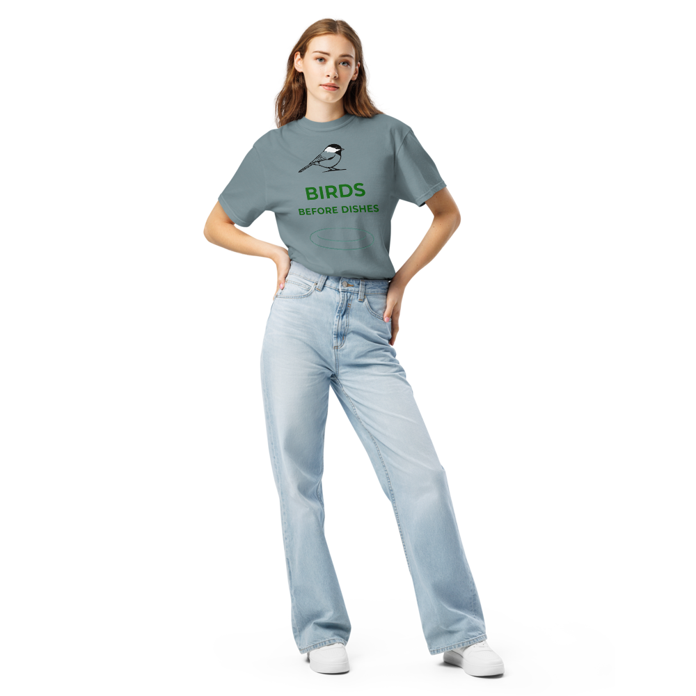 Woman wearing the Ice Blue chickadee shirt with a chickadee above BIRDS BEFORE DISHES and a plate outline