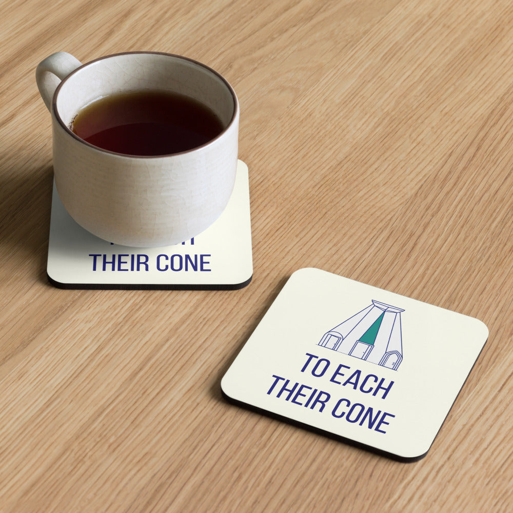 Two To Each Their Cone coasters on a wooden table, one under a cup of tea