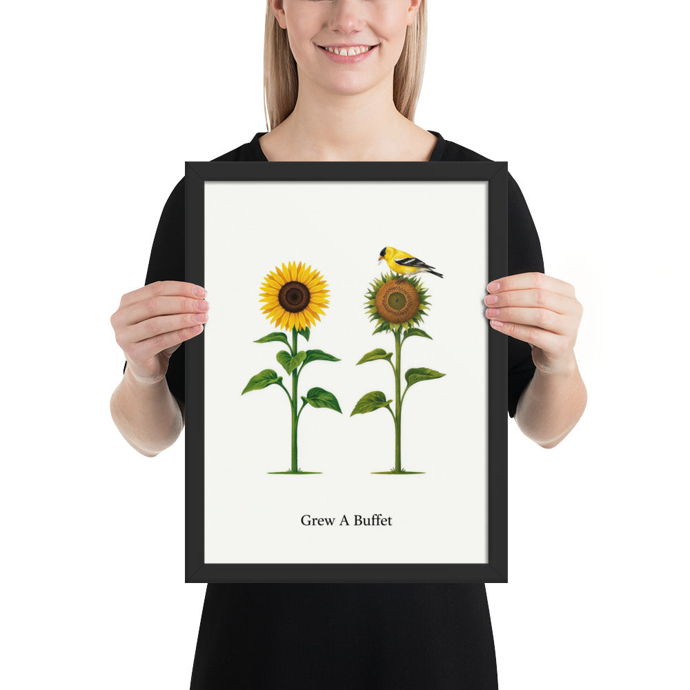 Person holding the 12x16 Grew A Buffet framed sunflower and goldfinch print to show its size