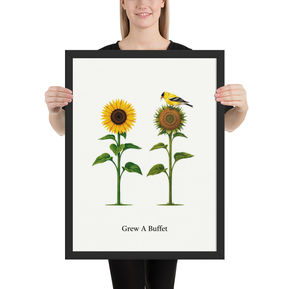 Person holding the 18x24 Grew A Buffet framed sunflower and goldfinch print to show its size
