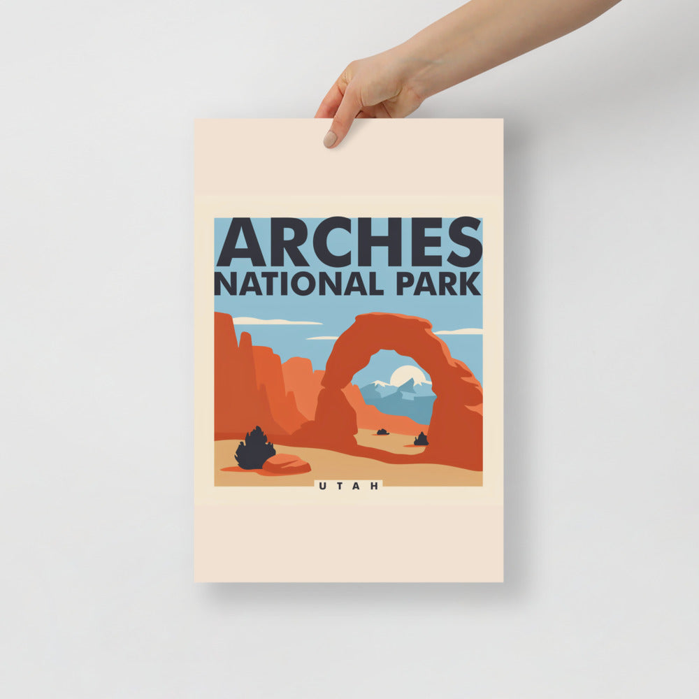 Arches National Park vintage poster held flat against a plain grey wall