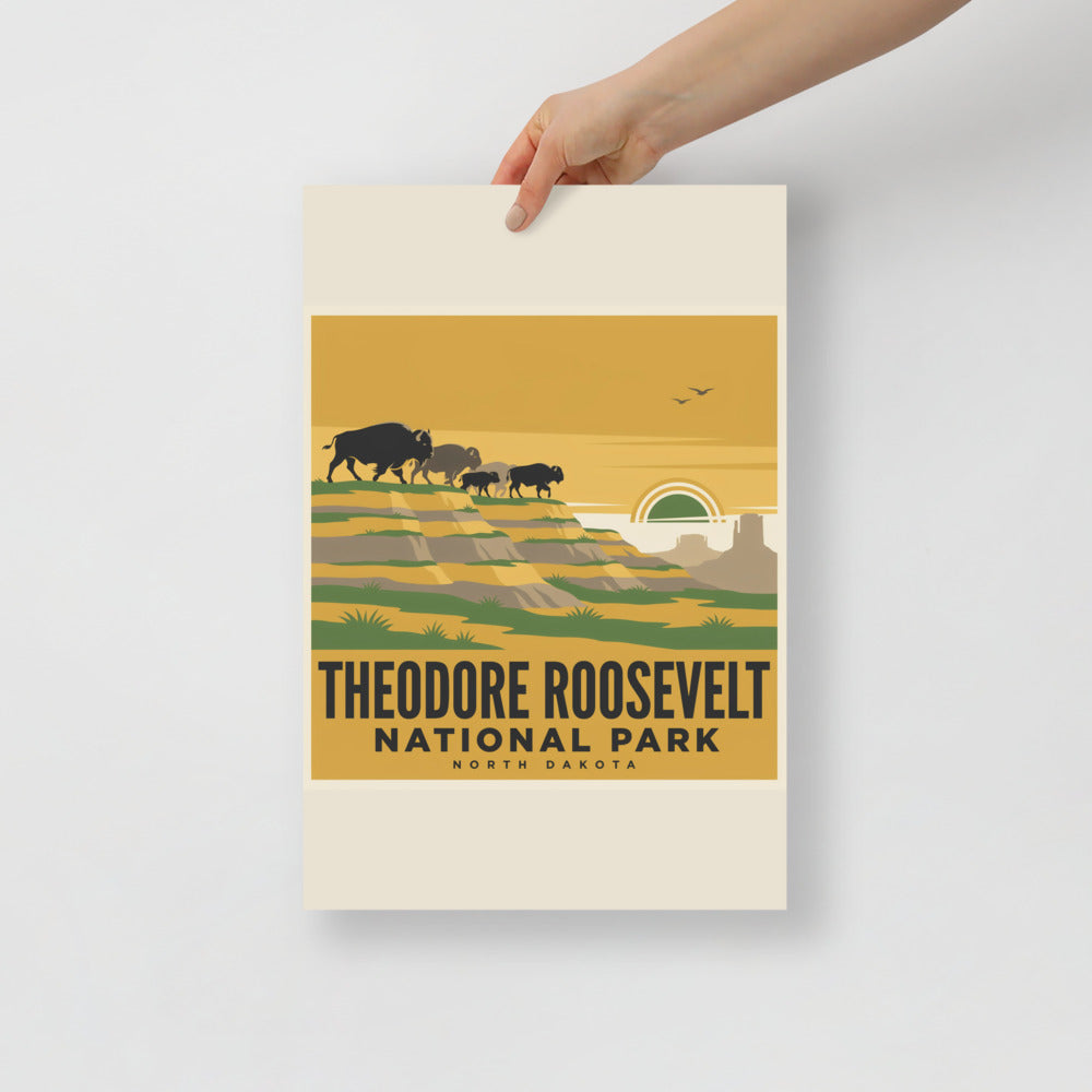 Theodore Roosevelt National Park vintage poster held flat against a plain grey wall