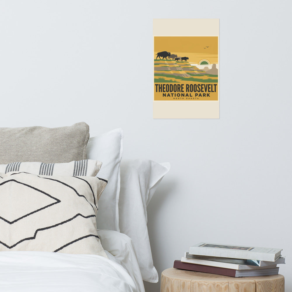 Theodore Roosevelt National Park vintage poster hanging on the wall above a bed in a bright bedroom