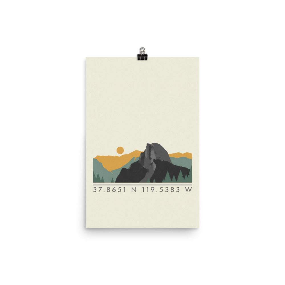 12″×18″ Yosemite coordinates poster hanging from a black binder clip: low landscape strip on a cream sheet