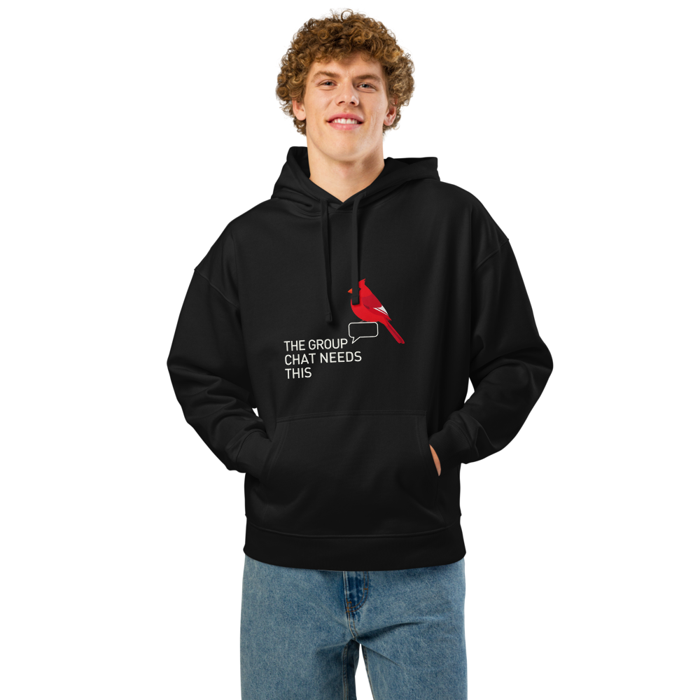 Man wearing the black funny bird hoodie with a cardinal and speech bubble beside THE GROUP CHAT NEEDS THIS