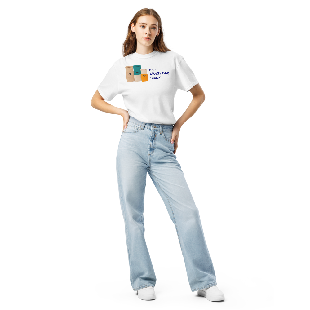 Woman wearing the white funny bird shirt with three seed bags beside IT'S A MULTI-BAG HOBBY