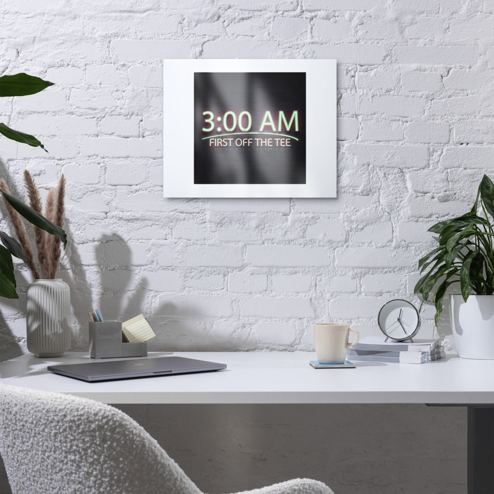 3:00 AM Tee Time metal print hanging above a white desk on a painted brick wall