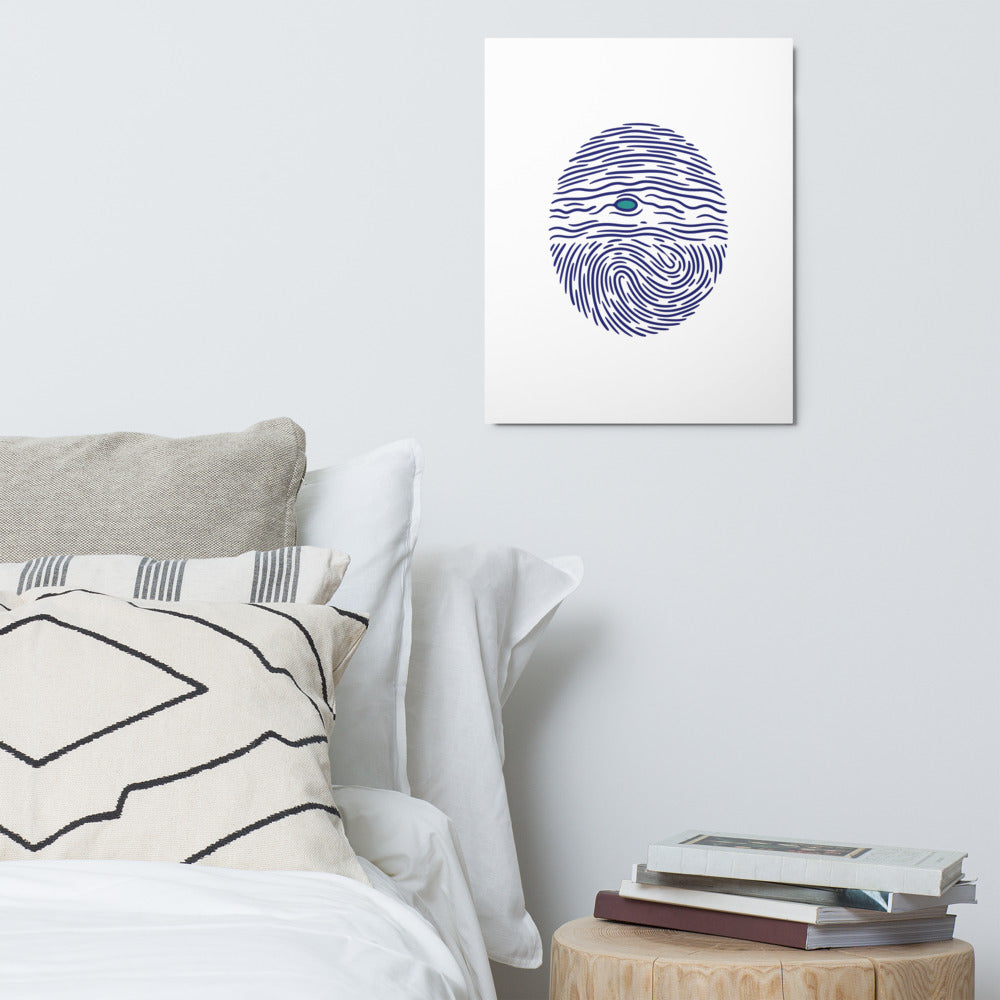 Jupiter fingerprint astronomy print on a pale bedroom wall above the bed and a stack of books