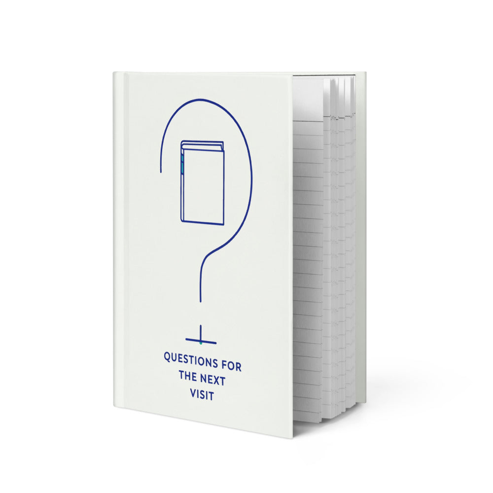 Birding journal standing at an angle, showing the ivory hardcover with the question mark design and the edge of the lined pages