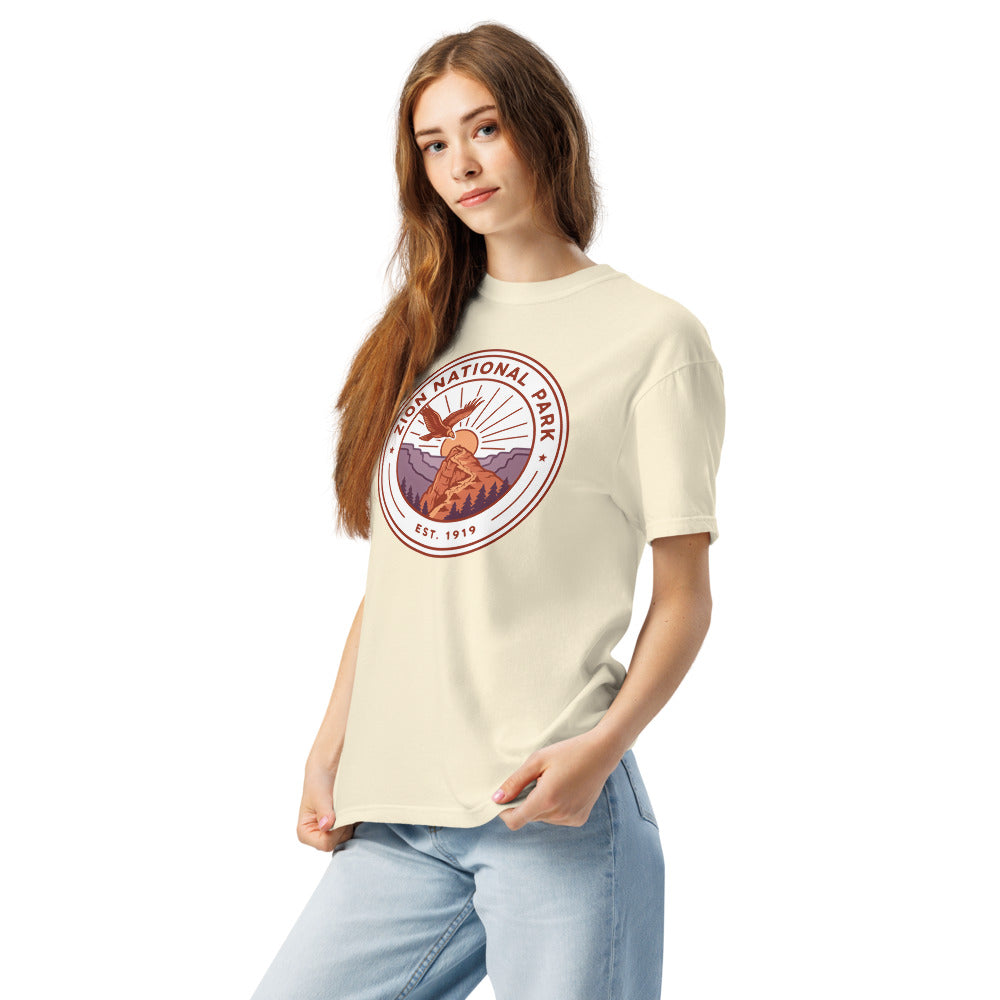Zion National Park WPA-style badge t-shirt worn on model, ivory, side angle