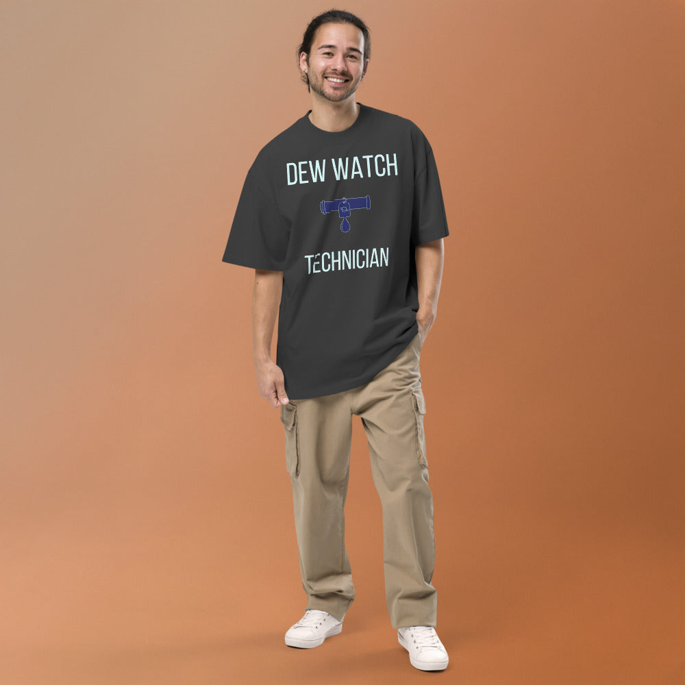 Smiling man wearing the Faded Black Dew Watch Technician oversized tee, full front view