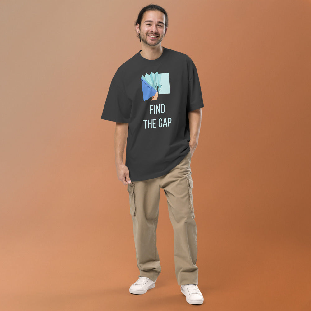Smiling man wearing the Faded Black Find the Gap oversized tee, full front view
