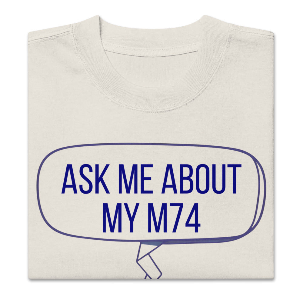 Folded Faded Bone messier shirt showing the ASK ME ABOUT MY M74 speech bubble up close