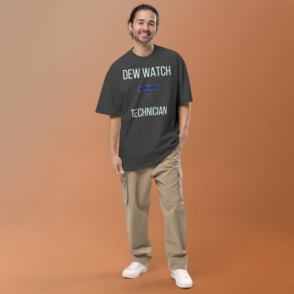 Smiling man wearing the Faded Coal Dew Watch Technician oversized tee, full front view