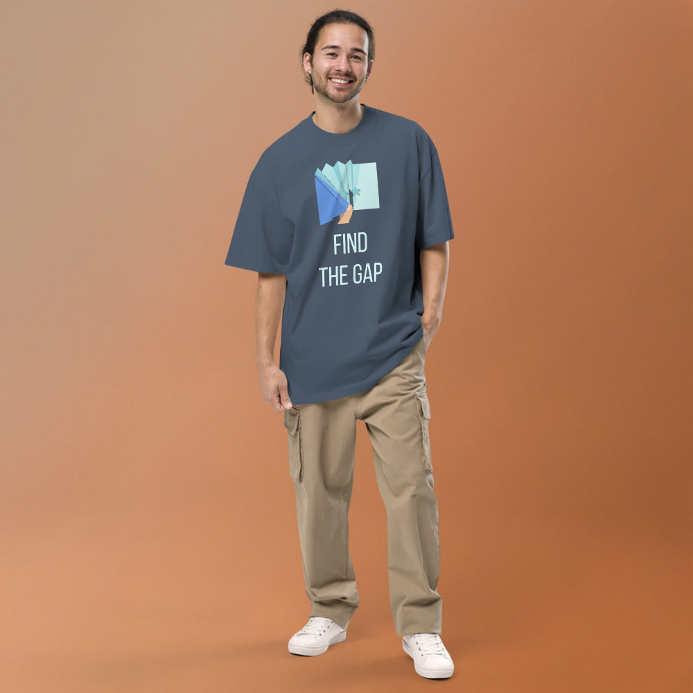 Smiling man wearing the Faded Indigo Find the Gap oversized tee, full front view