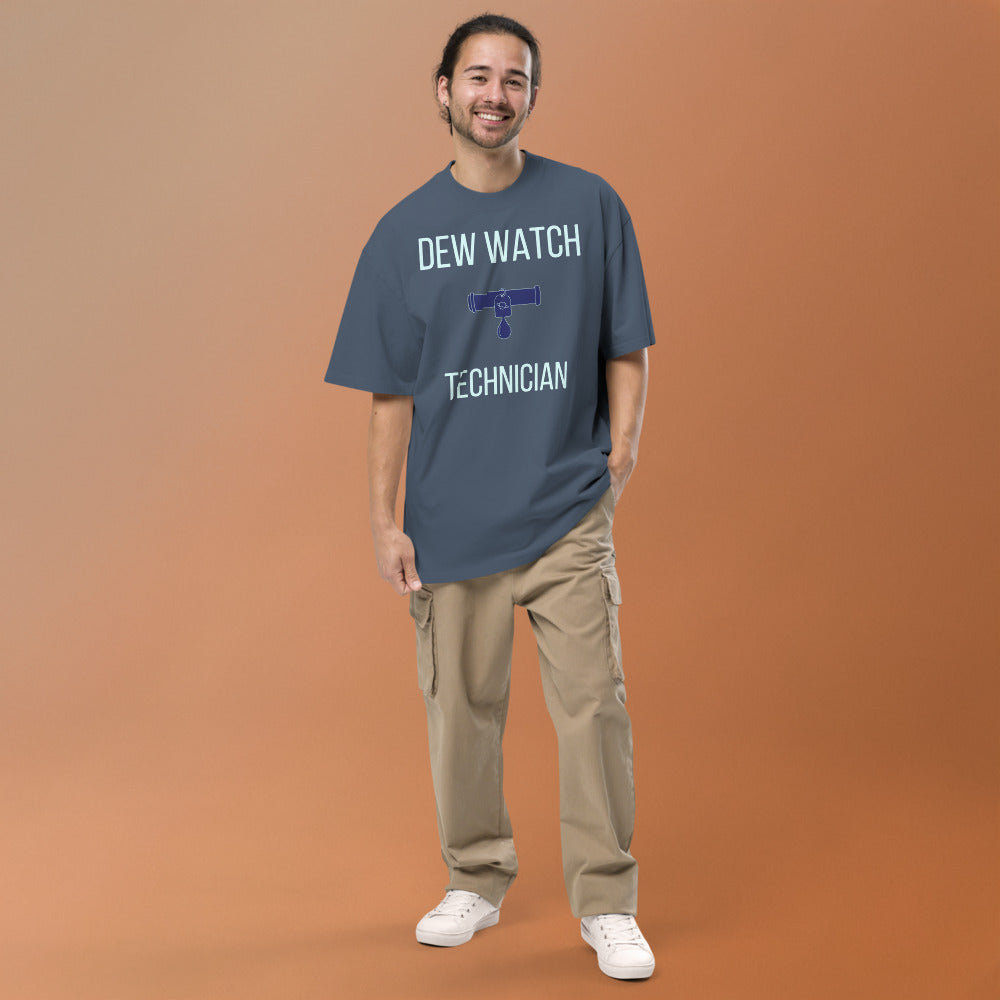 Smiling man wearing the Faded Indigo Dew Watch Technician oversized tee, full front view