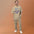 Man wearing the Faded Khaki Rille Survey Crew moon shirt against a warm studio backdrop, front view of the lunar pennant print