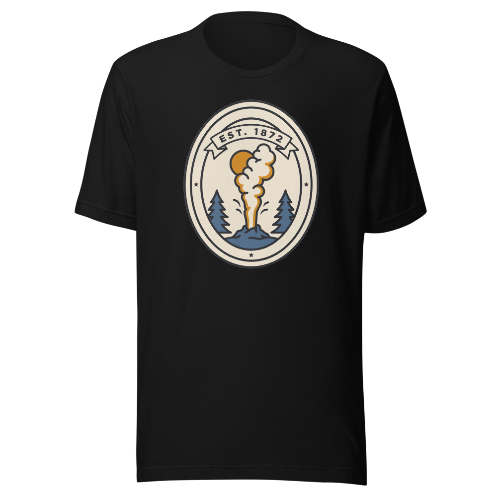Black unisex t-shirt printed with a cream oval badge of an erupting geyser and pines under an Est. 1872 ribbon