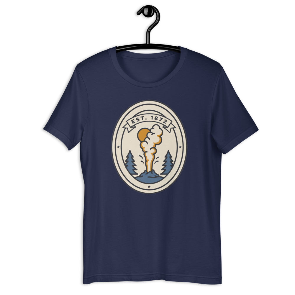 Navy Est. 1872 geyser badge t-shirt shown on a hanger with the full graphic visible